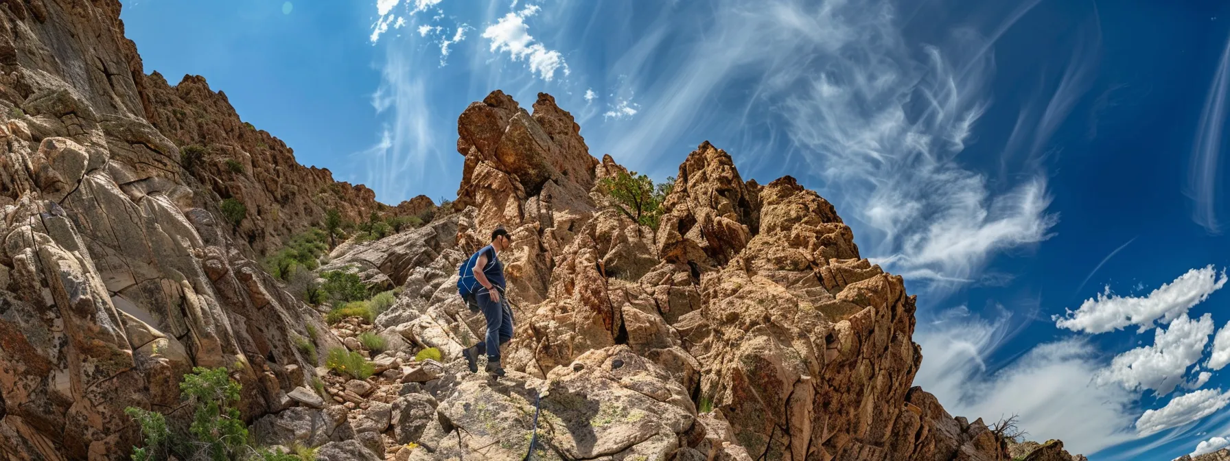 a determined hiker scaling a steep, rocky mountain trail, focusing intensely on their goal at the peak.